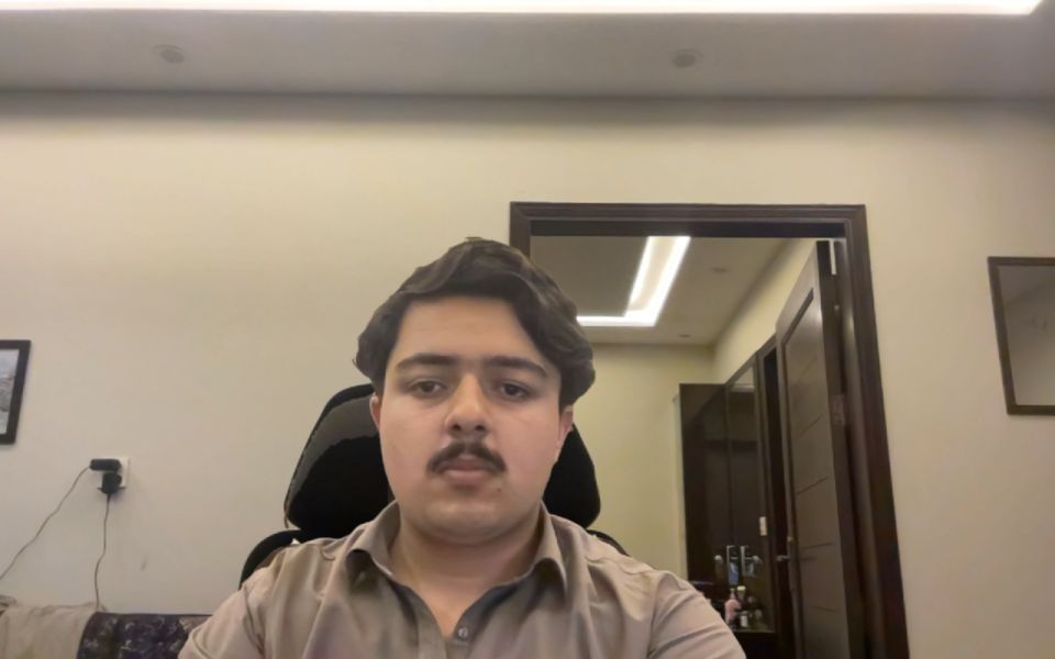 A person on a webcam call disintegrating into dust in front of an empty room